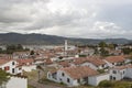 Guatavita colombian town cityscape with white structure, red ceramic roofs and andean mountains