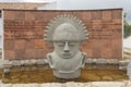 Guatavita native chief monument into waterfont with spanish leyend at background