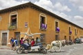 Antigua, Guatemala - March 2013: Horse carriage running in the street of Antigua in Guatemala