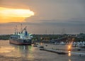 Sunset above coal ship and yachts, Puerto Quetzal, Guatemala