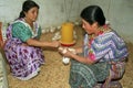 Guatemalan Indian women take care of chickens