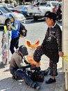 Solola, Guatemala - February 2024 : Locals getting shoeshine on street in Guatemala