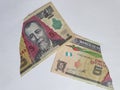 guatemalan banknotes of five quetzales on the broken sheet of paper