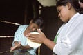 Guatemalan Indian teens preparing tortillas