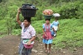 Guatemalan Indian women lugging laundry Royalty Free Stock Photo