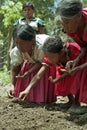 Guatemalan Indian women seeding vegetable seeds