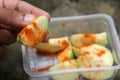 Guava pieces sprinkled with salt and red chilli powder, Spicy bowl of guava ready to be eaten