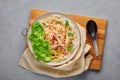 Guay Tiew Gai Cheek or Thai Chicken Noodle Soup in white bowl on gray concrete backdrop. Thai food Royalty Free Stock Photo