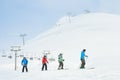 Gudauri, Georgia - 24th january, 2022: Caucasian male ski instructor teaching to ski family two kids and father beginner skier in