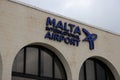 Front view of the sign `Malta International Airport` above the main entrance of the international airport of Malta