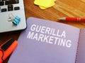 Guerilla marketing guide and laptop.