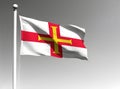 Guernsey national flag waving on gray background