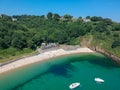 Guernsey small beach with sea, cliffs and little boat Royalty Free Stock Photo