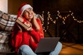 Happy Woman Shaking Christmas Present At Home Using Pc Royalty Free Stock Photo