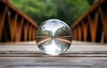 guessing for the future crystal ball on the wooden bridge as a concept of the way between past and future