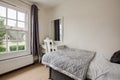 Guest bedroom decorated in shades of grey