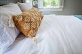 A guest bedroom with a queen sized bed and nightstand at a short term rental small cottage style house