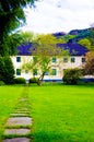 Guest House with Green Lawn and Rocky Path, Norway