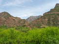 Guest house with red roof. Stone cottage in lush greenery in the mountains. Dagestan Royalty Free Stock Photo