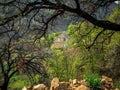 Guest house with white roof. Stone cottage in lush greenery in the mountains Royalty Free Stock Photo