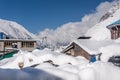 Guest houses in the Village Kyangjin Gompa covered by snow Royalty Free Stock Photo