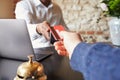 Guest makes card payment at check-in desk of hotel, detail Royalty Free Stock Photo