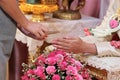 Guest pouring water with bride and groom hands in water relaunch ceremony. Thai traditional wedding Royalty Free Stock Photo