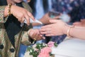 Guest pouring water with bride and groom hands in water relaunch Royalty Free Stock Photo