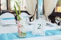 Guest wedding table with number two. Decorated and numbered wedding table with food