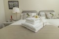 Stylish bedroom and linens in neutral tones Royalty Free Stock Photo