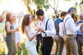 Guests dancing at wedding reception outside in the backyard. Royalty Free Stock Photo