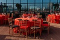 Guest table setting for banquet in black, red and gold style. Elegant and luxury dinner arrangement: decor, tablecloth