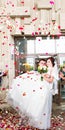 Guests Throwing Confetti Over Bride And Groom At Wedding Royalty Free Stock Photo