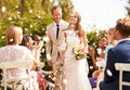 Guests Throwing Confetti Over Bride And Groom At Wedding Royalty Free Stock Photo