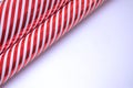 Guft wrapping paper with red and white stripes on white background with copy space for present packing.