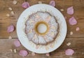 Gugelhupf cake with powdered sugar and blossom