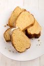 Gugelhupf sprinkled with powdered sugar on a cake stand