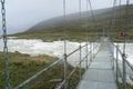 The Guhkesvakkjahka suspension bridge between Sarek and Stora Sjofallet national parks in Sweden. Bridhe over wild