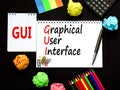 GUI graphical user interface symbol. Concept words GUI graphical user interface on white note on a beautiful black background. Royalty Free Stock Photo