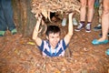 A guide demonstrating how a Vietcong hide into the Tunnel Royalty Free Stock Photo