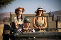 Guide driving two female guests in jeep Royalty Free Stock Photo