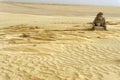 Guide in the Ong Jemel Desert in Tunisia Royalty Free Stock Photo