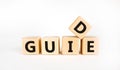 Guide and support symbol. The concept word `guide` on wooden cubes on a beautiful white table. White background. Business and Royalty Free Stock Photo