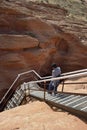 Guide walking down the entrance stairs at Lower Antelope Canyon, Hasdestwazi, LeChee Chapter, Navajo Nation, Arizona