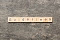 Guidelines word written on wood block. Guidelines text on table, concept Royalty Free Stock Photo