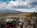 Guides porters and sherpas carry heavy sacks as they ascend mount kilimanjaro the tallest peak in africa.