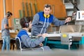 guiding handicapped carpentry apprentice Royalty Free Stock Photo