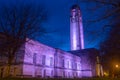 The Guildhall at night, illuminated purple.