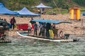 Closeup of landing of 6-person raft ferry along Li River in Guilin, China