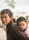 Closeup of grandmother and young boy on her back, Guilin, China